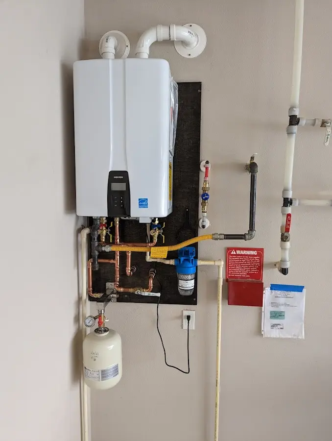 Professional plumber installing copper piping in a Bay Harbor Islands home